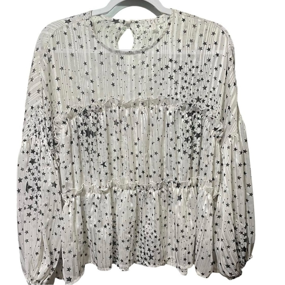 Sheer white, silver top with black stars